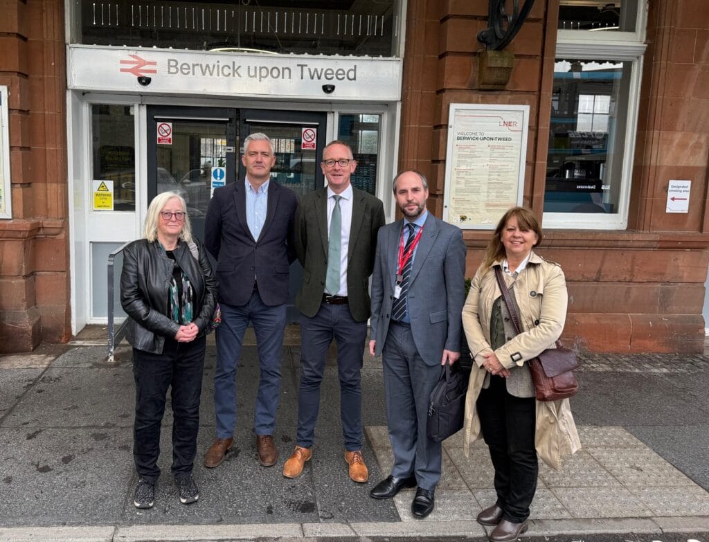David Smith MP and other local leaders stand outside Berwick-upon-Tweed train station