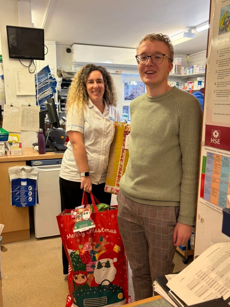 Wellway Pharmacy team with gifts